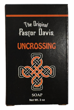 Load image into Gallery viewer, Black soap packaging with &#39;The Original Pastor Davis Uncrossing&#39; text and a cross design on a white background.
